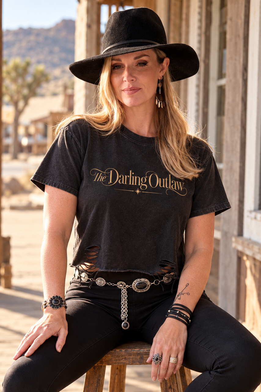 Black The Darling Outlaw distressed graphic tee with gold lettering and raw hem — product view 9