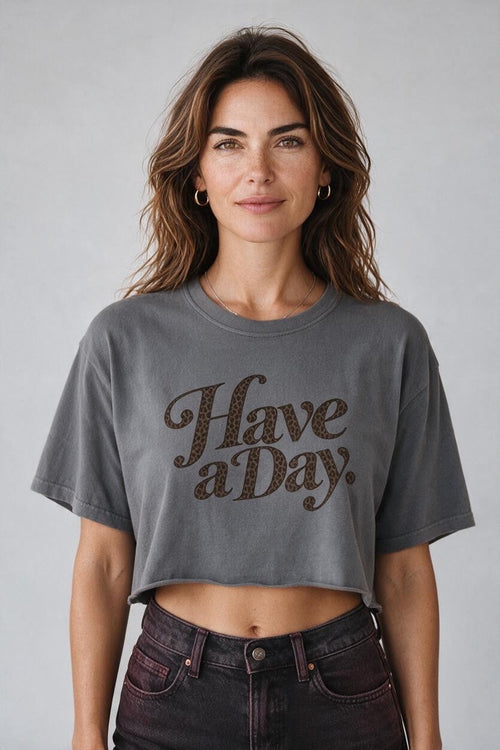 The Darling Outlaw gray cropped cotton t-shirt with leopard print Have a Day lettering and a raw-edge hem.